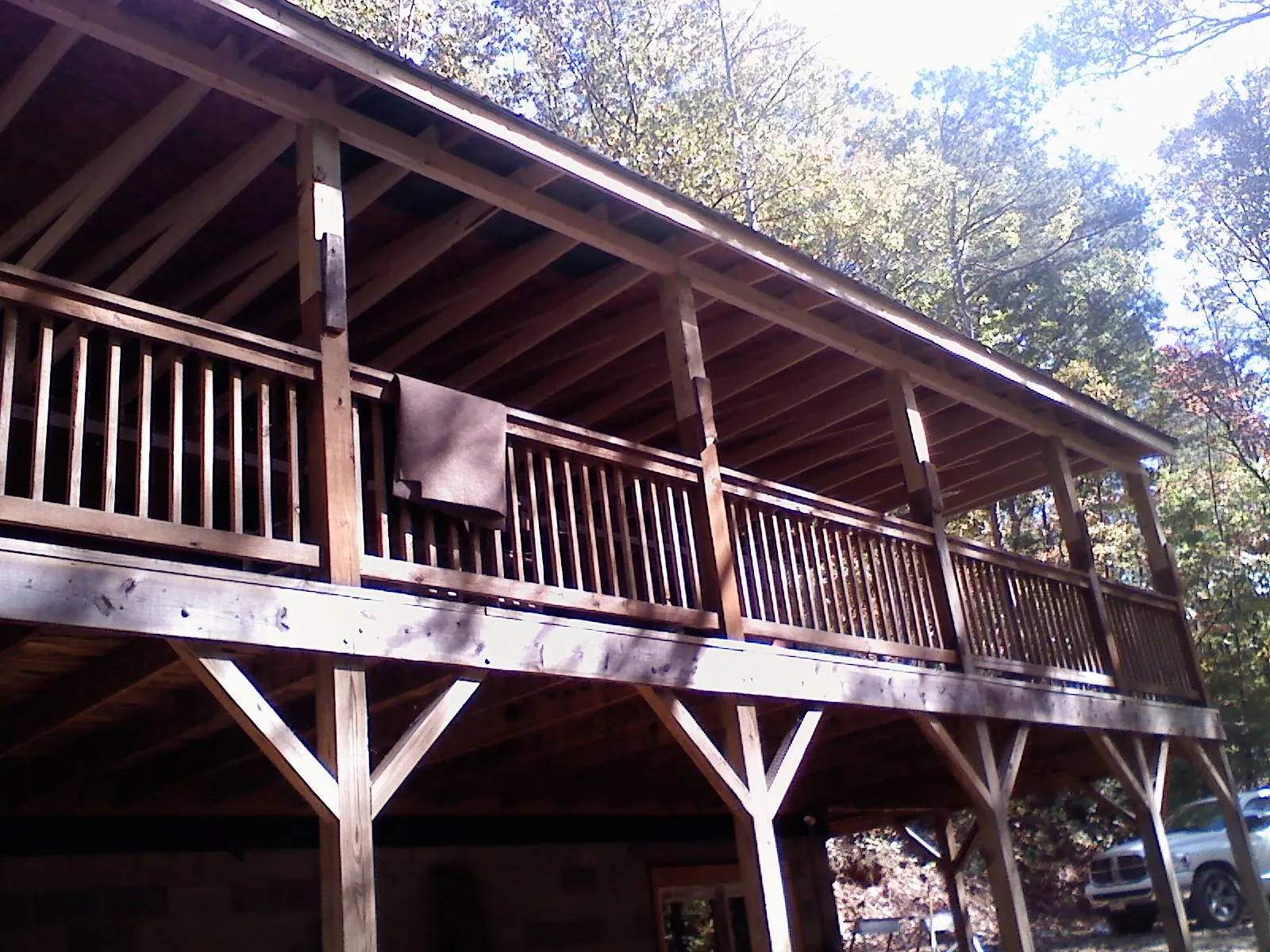 Timber framing under a new elevated porch and deck — Roof Leak Repair in Montezuma by Roofing Brothers